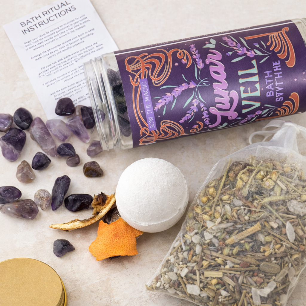 Lunar Veil Bath Ritual Kit contents displayed on light background with amethyst crystals, bath bomb and herbal soak pouch
