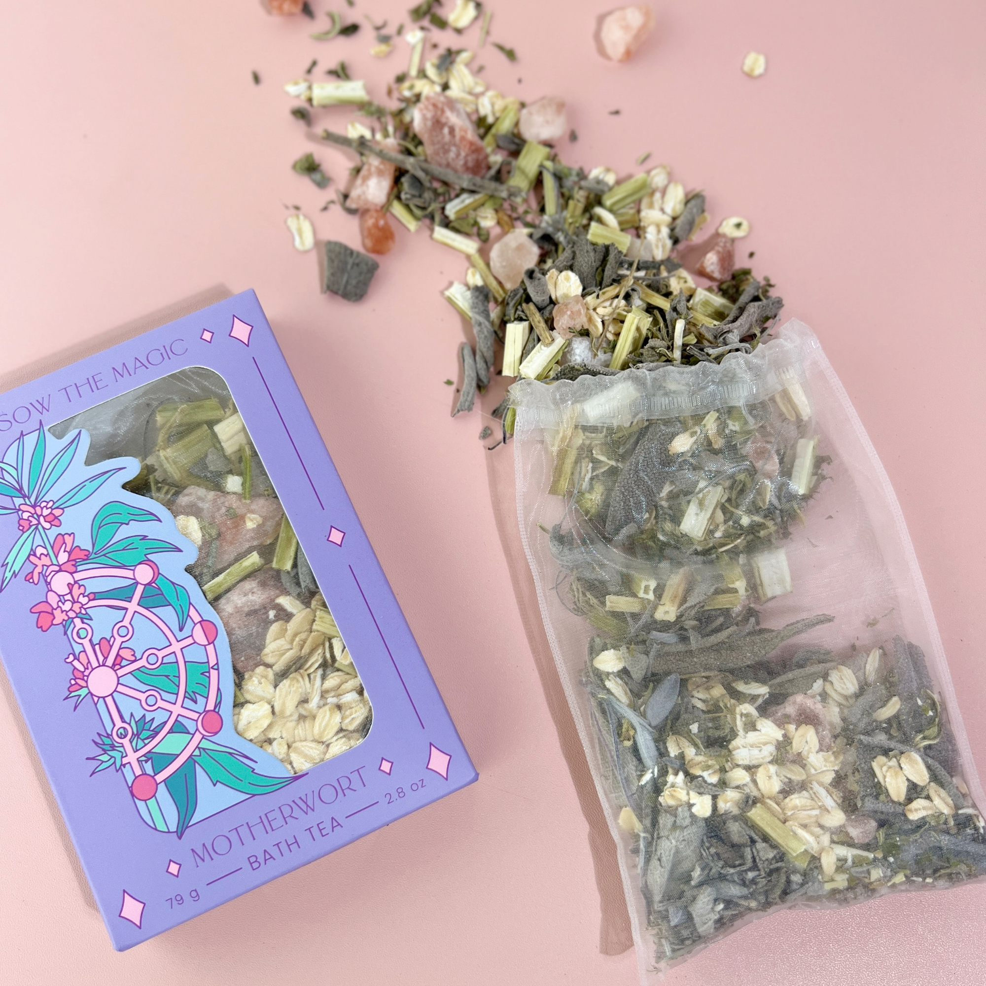 Motherwort Tarot Botanical Bath Tea Box by Sow the Magic with loose herbs and reusable tea bag on pink background.