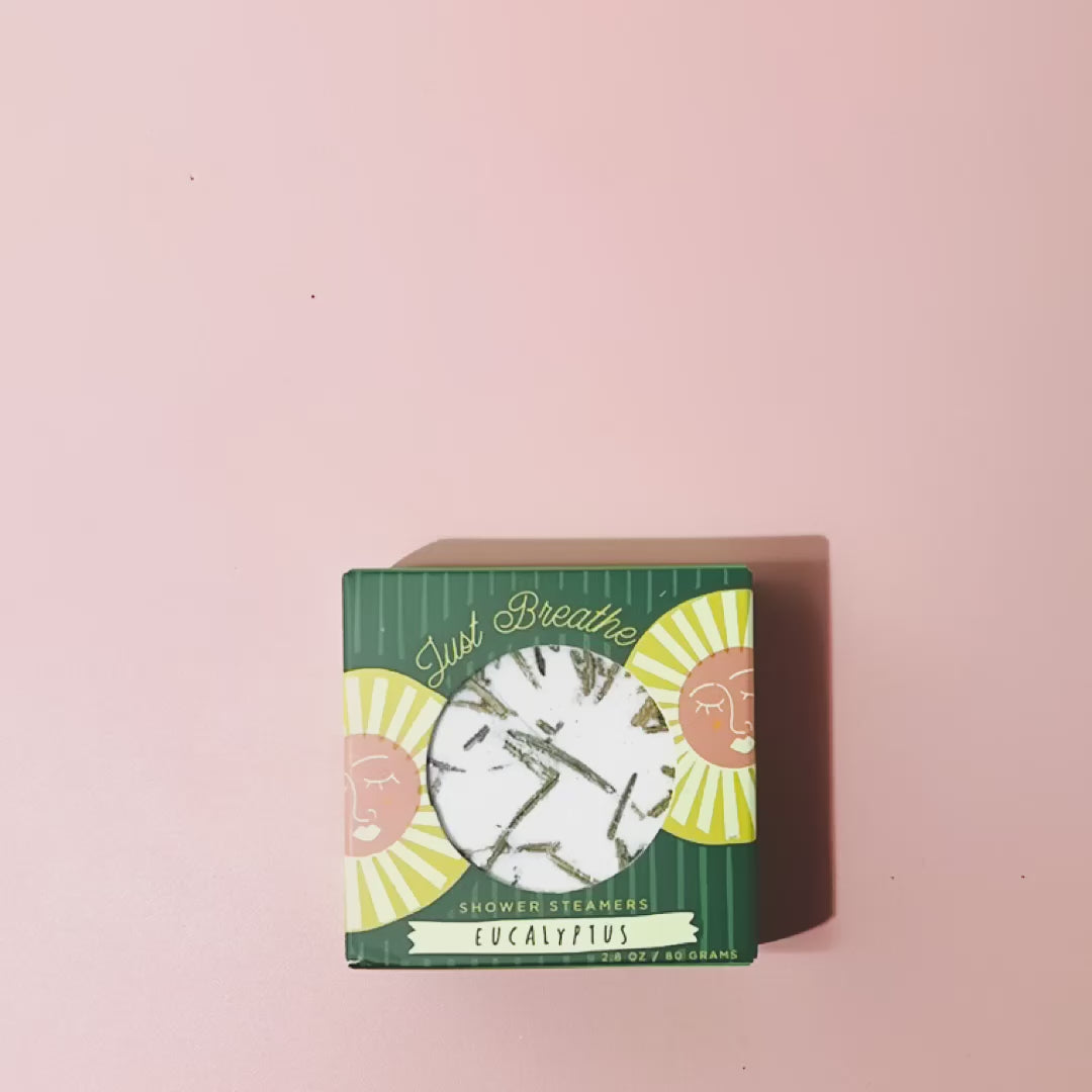 Eucalyptus shower steamer fizzing and dissolving in shower releasing refreshing herbal aromatherapy steam