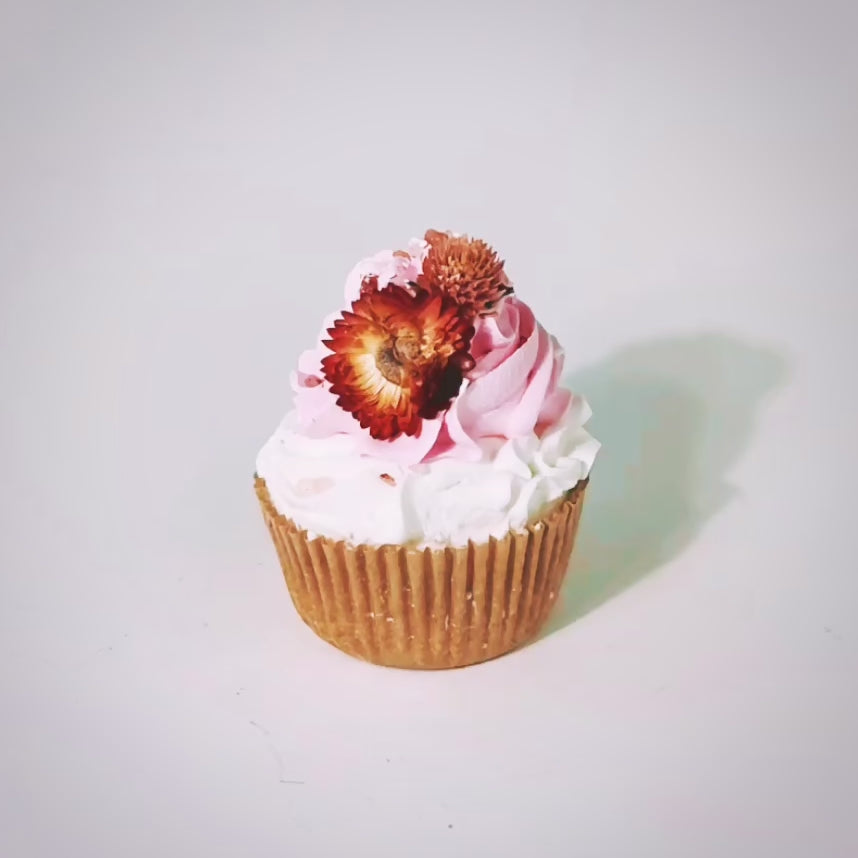 Peppermint Flowers Cupcake Bath Bomb fizzing in water showing sugar scrub icing and floral topping dissolve