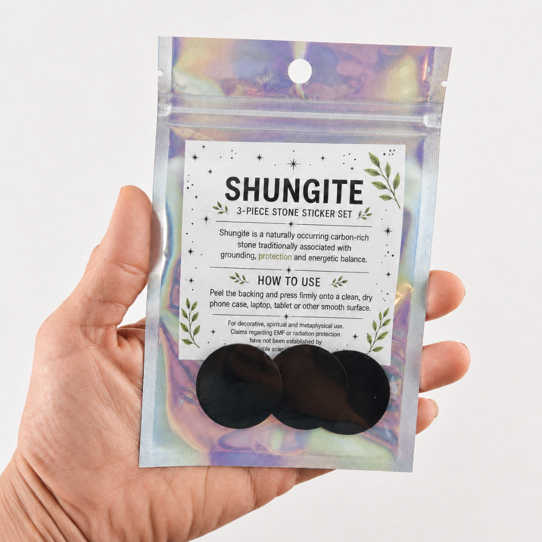 Shungite 3-piece stone sticker set displayed in iridescent retail packaging with instructions