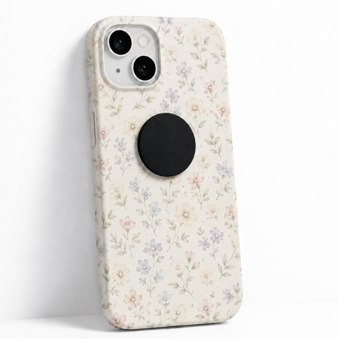lack Shungite stone sticker attached to the back of a smartphone with floral phone case
