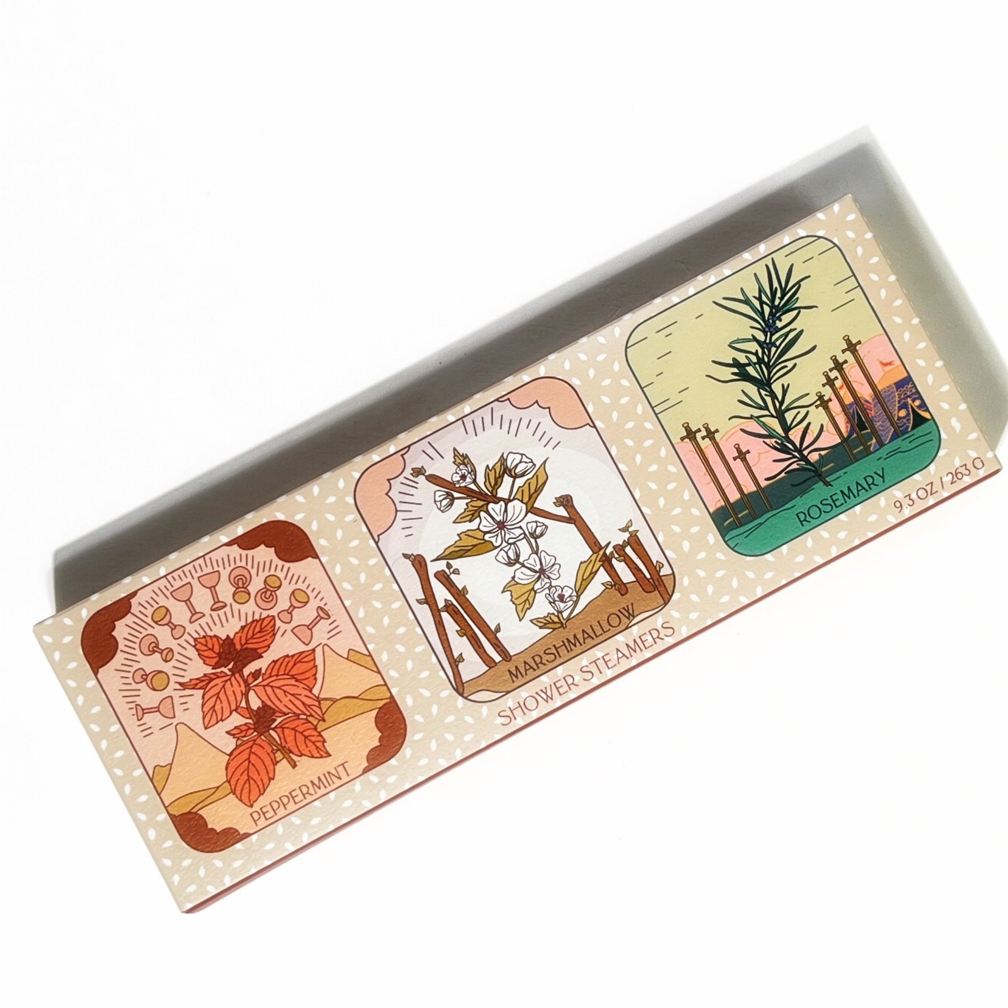Three tarot shower steamers with natural botanicals paired with matching tarot-inspired packaging