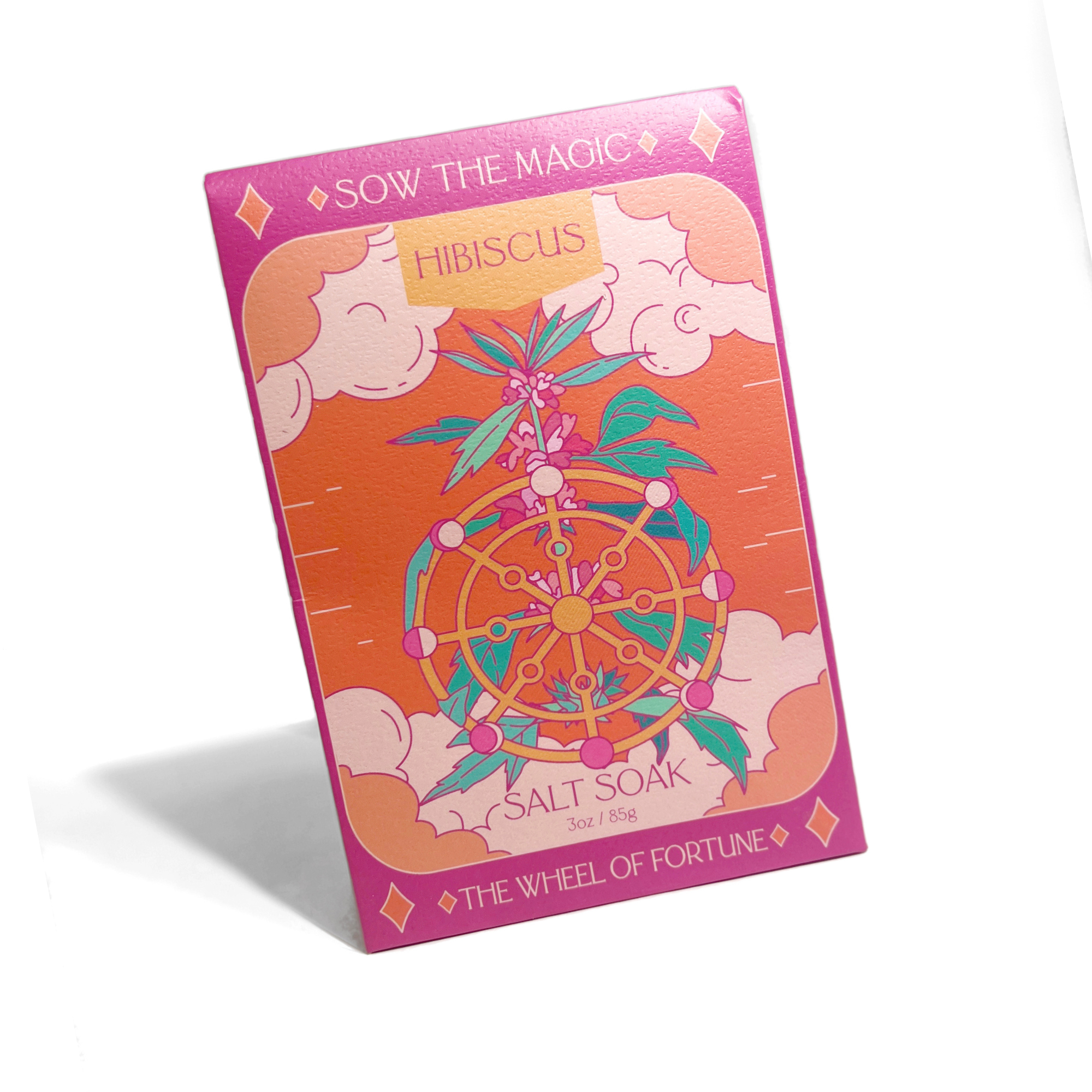 Sow the Magic Hibiscus Salt Soak tarot card design with orange and pink clouds and golden fortune wheel