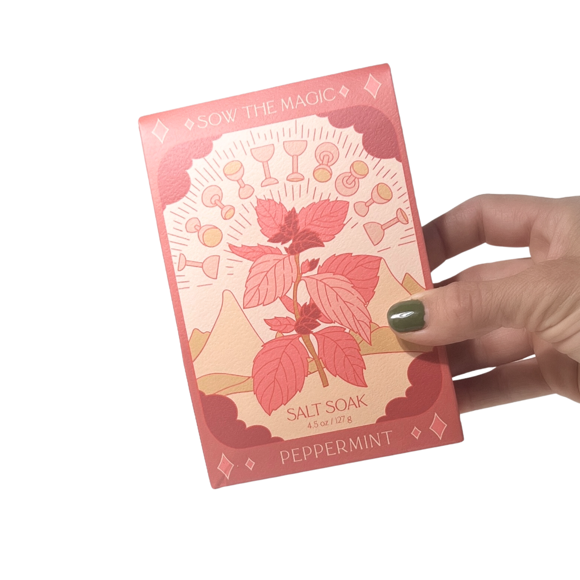 Peppermint Salt Soak tarot box held in hand showing red Ten of Cups inspired artwork