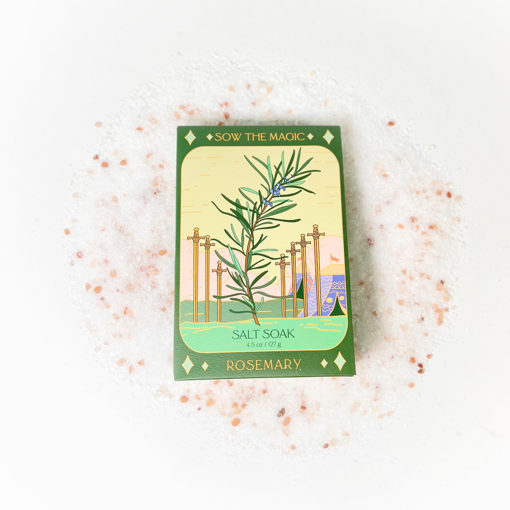 Rosemary Salt Soak tarot box placed on textured salt background featuring delicate pink mineral crystals