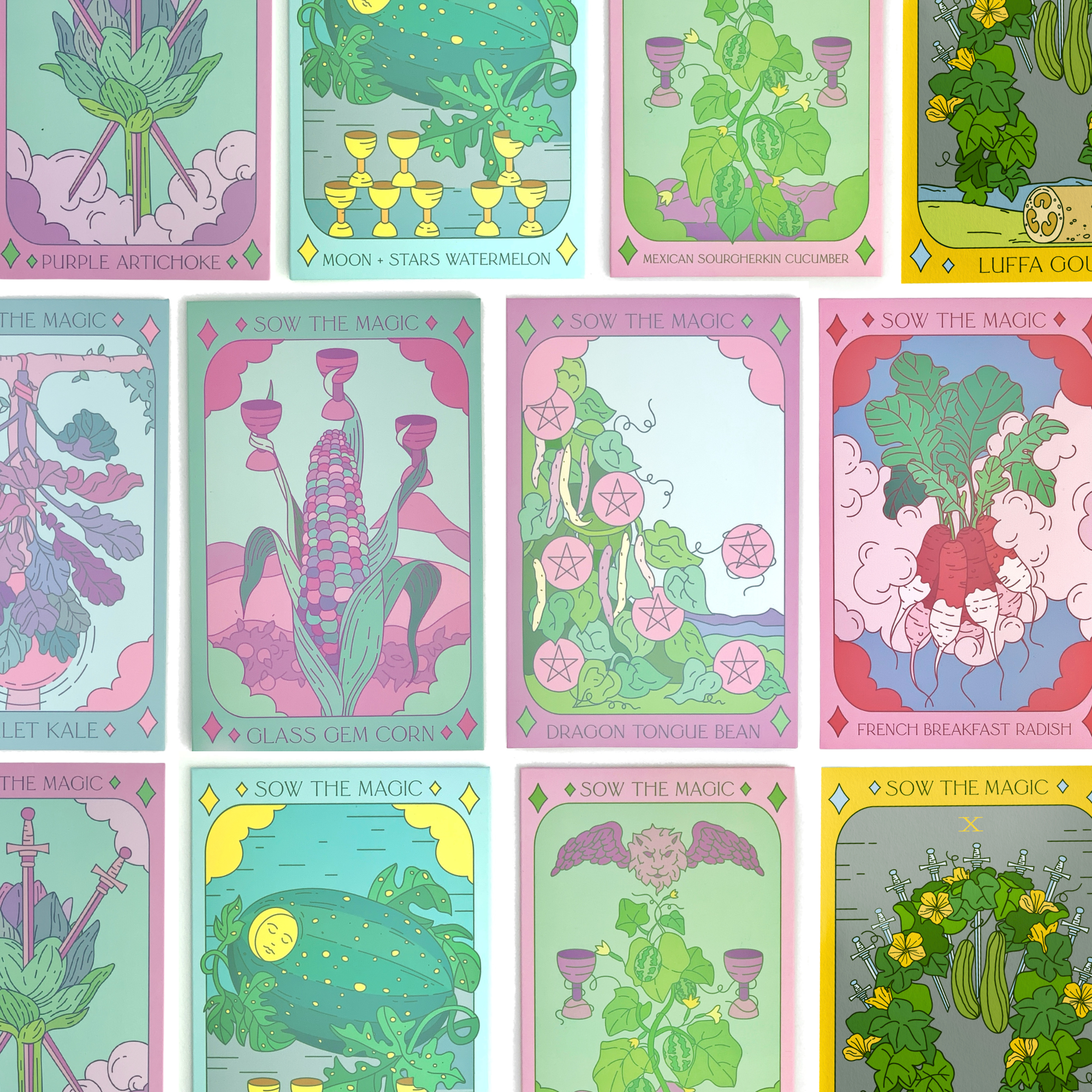 Collection of Sow the Magic tarot seed packets including Glass Gem Corn, Dragon Tongue Bean, Luffa Gourd, and more