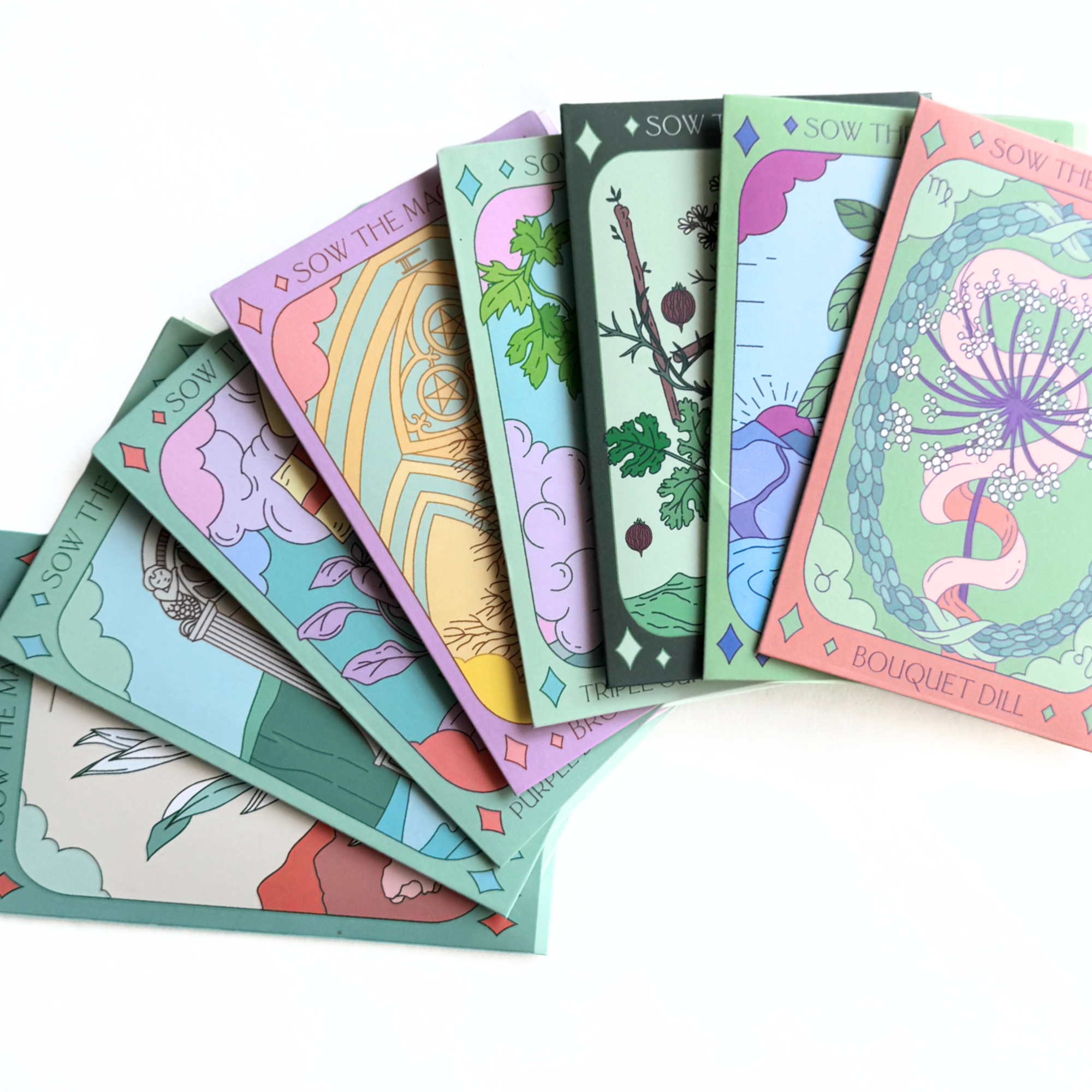Fanned display of Sow the Magic herbal tarot seed packets including Dill, Thyme, Sage, and Basil