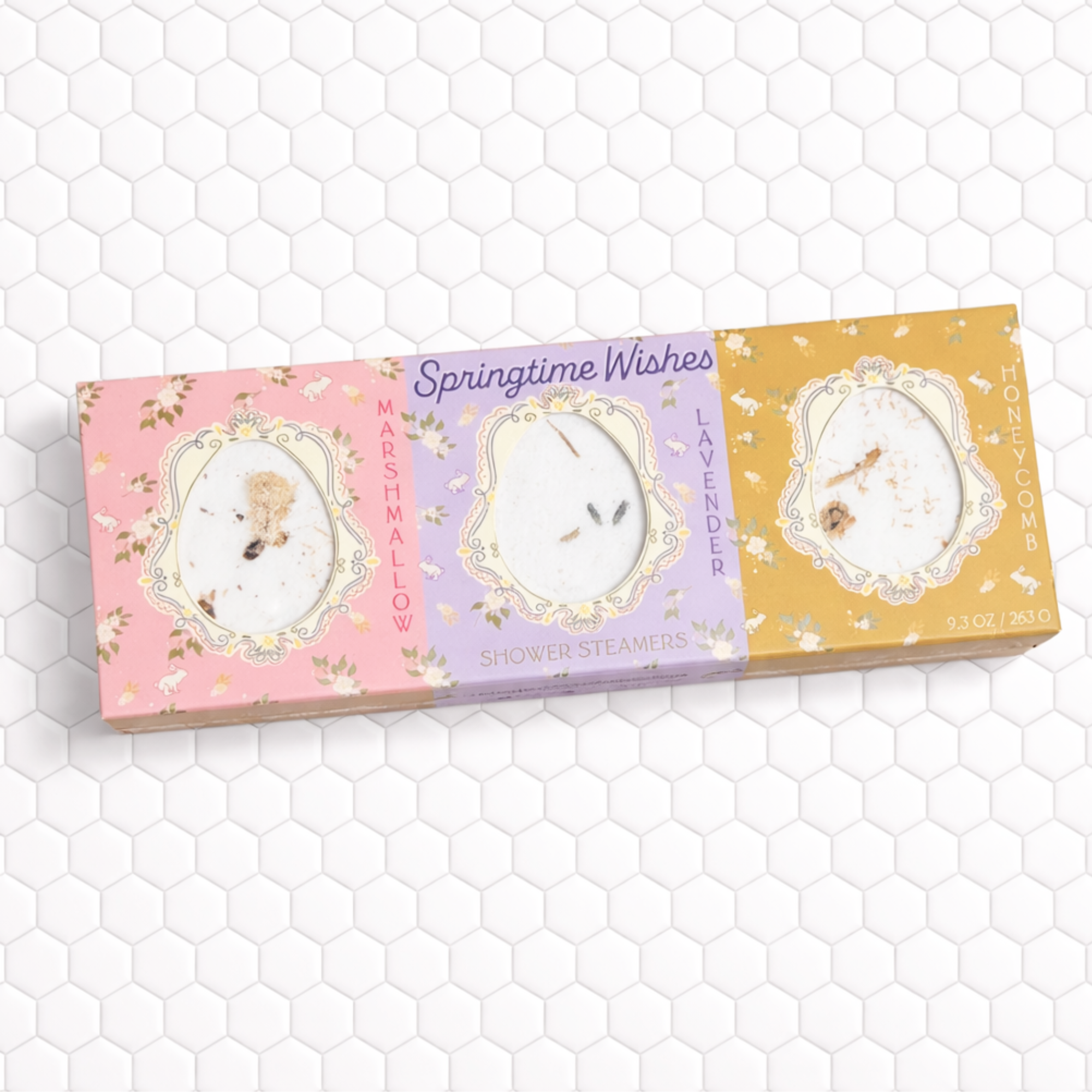 springtime shower steamer trio on marble bathroom counter with candle towel and soft floral accents