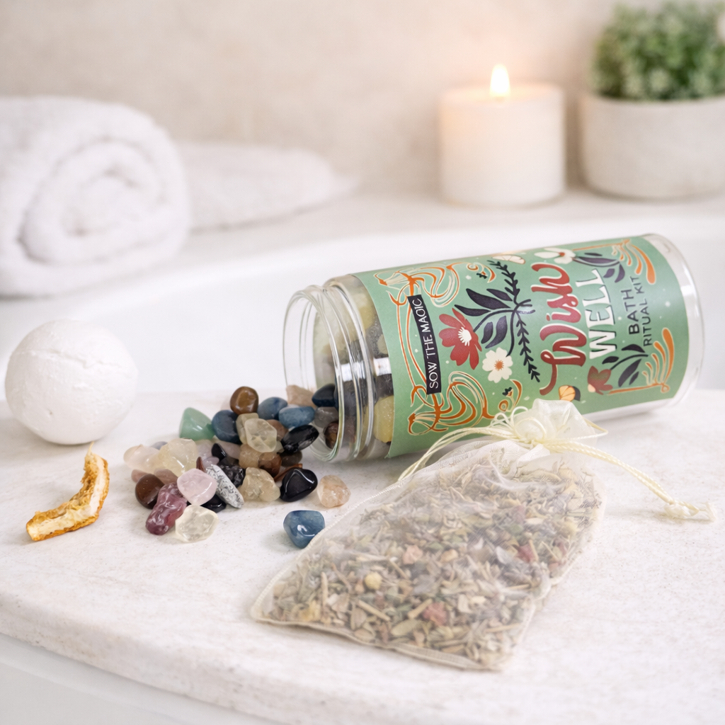 Wish Well Bath Ritual Kit styled in bathroom with bath tea pouch, gemstones, dried citrus, bath bomb and instructions