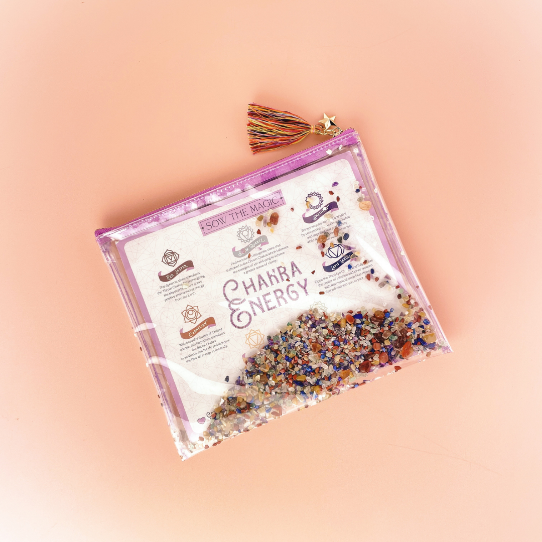 Top view of Chakra Energy Bag showing multicolored chakra stones and gold star tassel