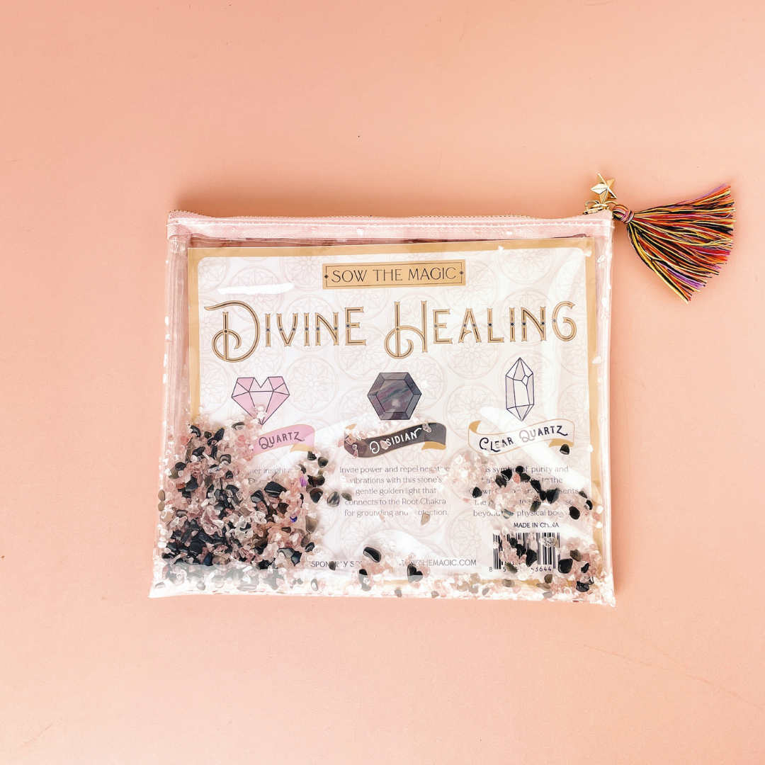 Flatlay of Divine Healing Gemstone Cosmetic Bag with tassel and healing crystal stones inside