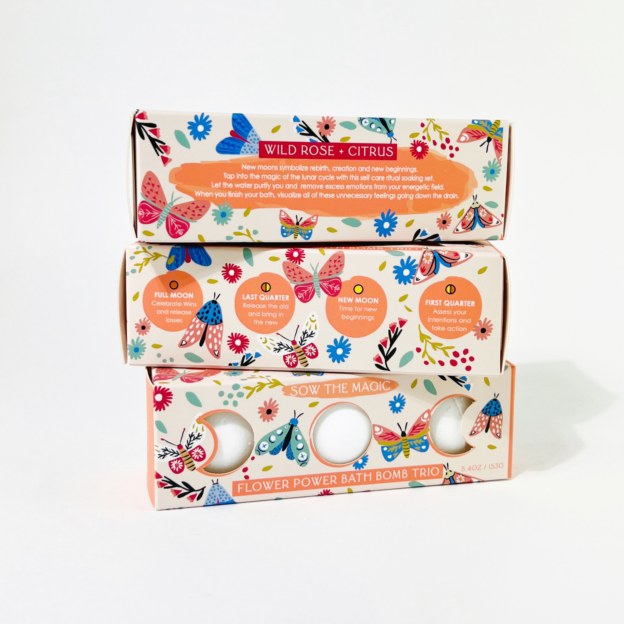 Stacked Sow the Magic Flower Power Bath Bomb Trio boxes with pink and orange design