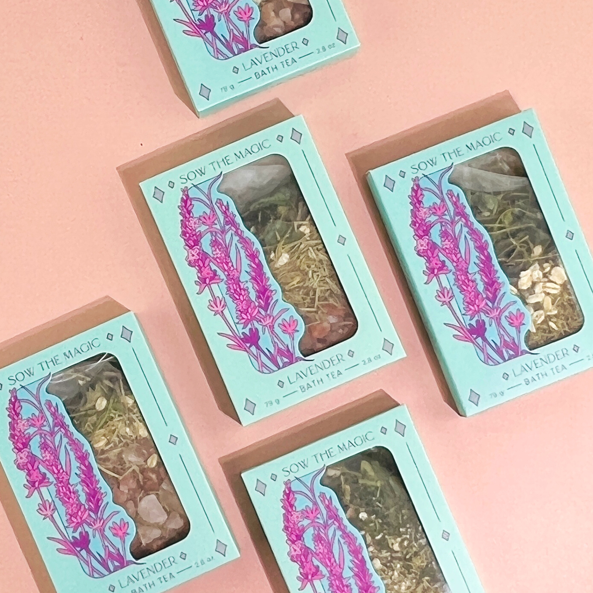 Lavender Lovers Tarot Botanical Bath Tea Boxes arranged on soft pink background highlighting calming lavender design.