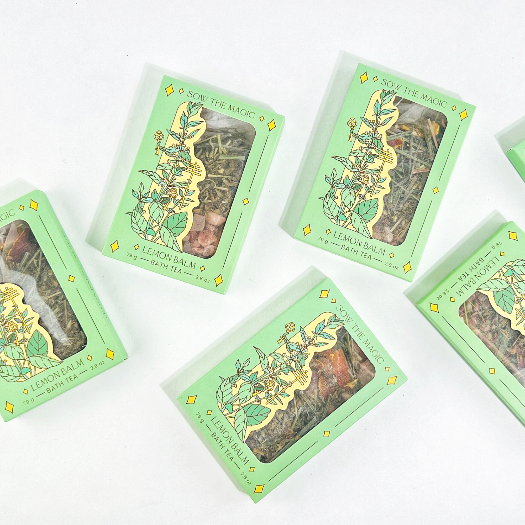 Multiple Lemon Balm Tarot Botanical Bath Tea Boxes by Sow the Magic arranged on white background for product display.