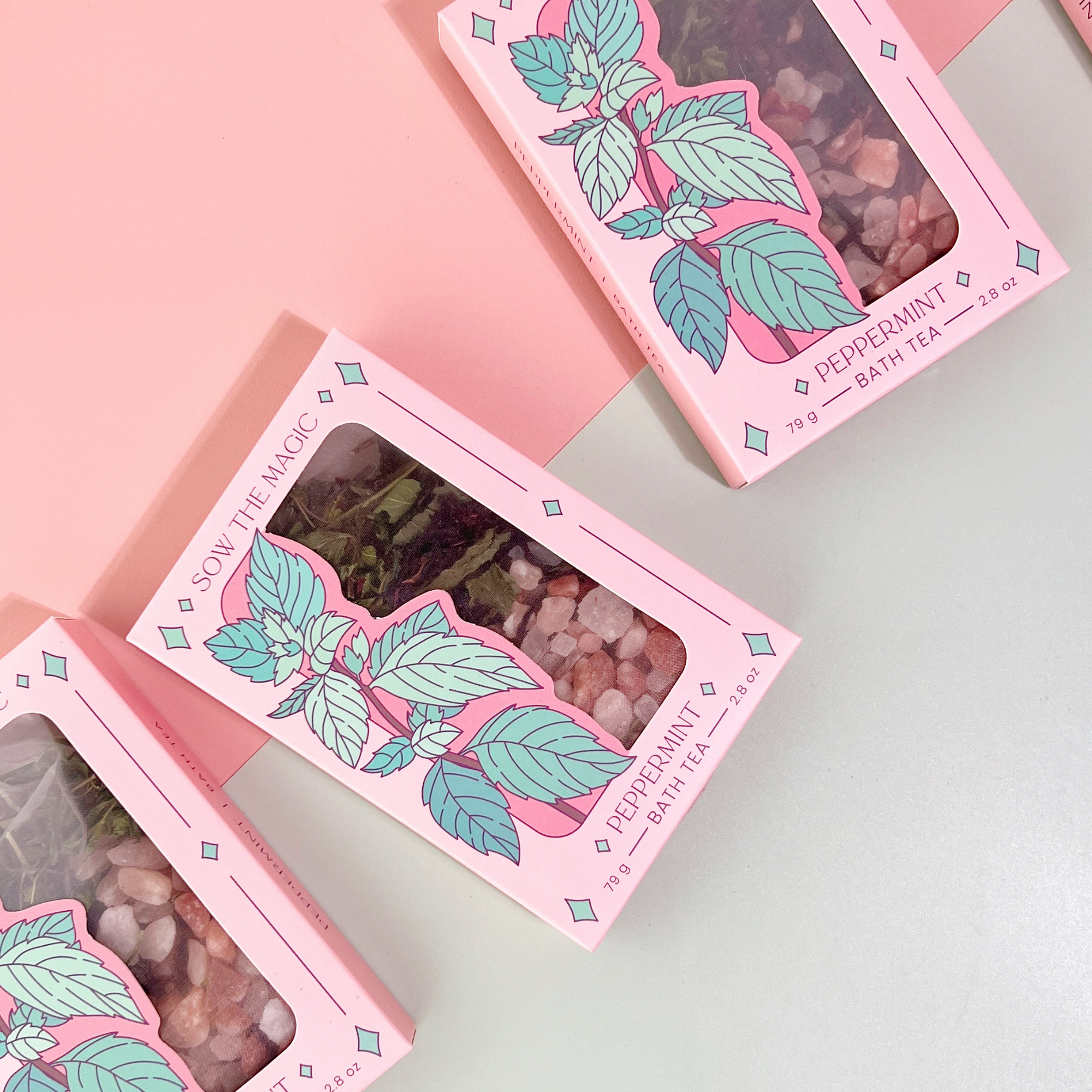 Peppermint Tarot Botanical Bath Tea Boxes by Sow the Magic displayed on pink background, featuring mint leaf artwork and herbal blend.