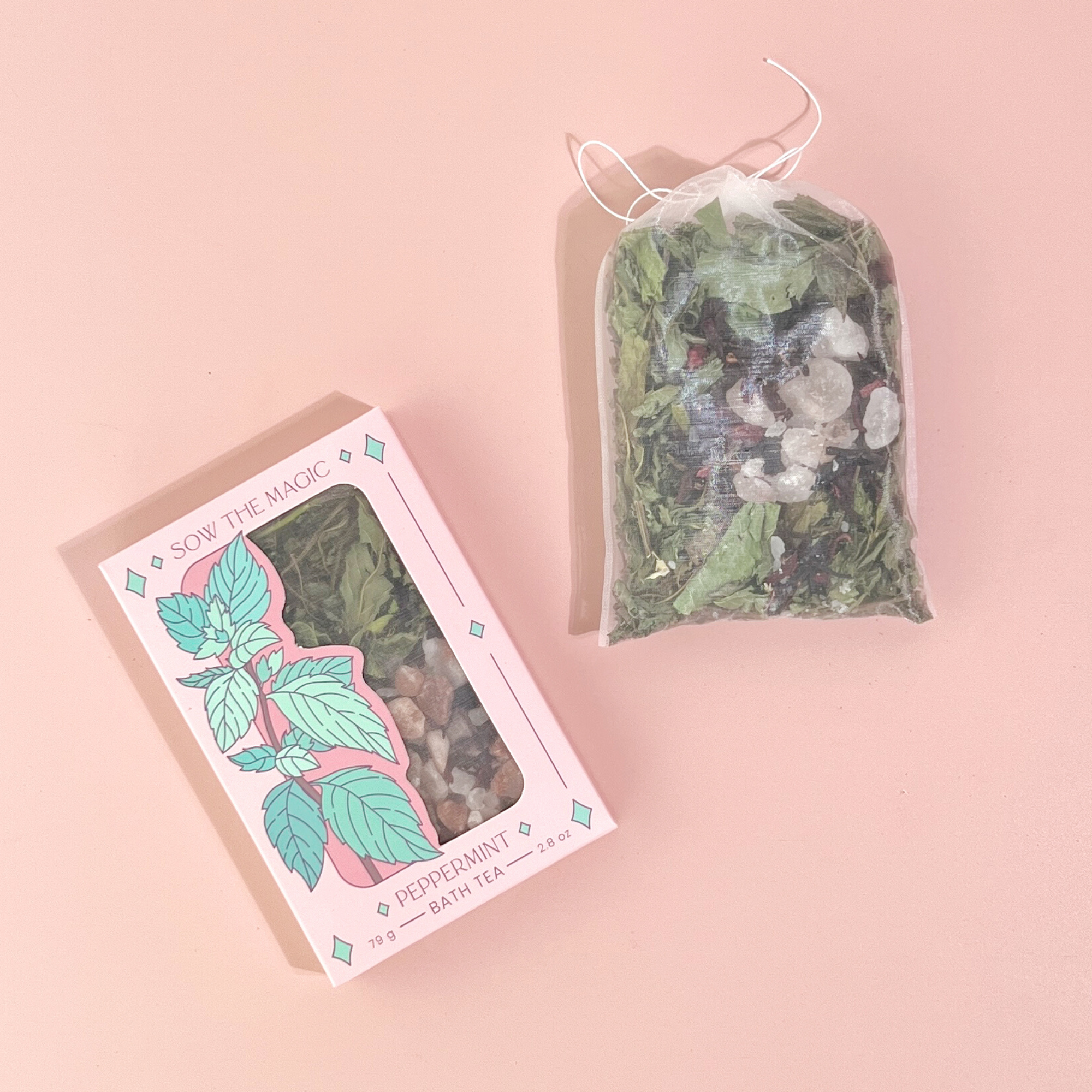 Open Peppermint Tarot Botanical Bath Tea Box beside reusable tea bag filled with dried herbs, salt and botanicals.