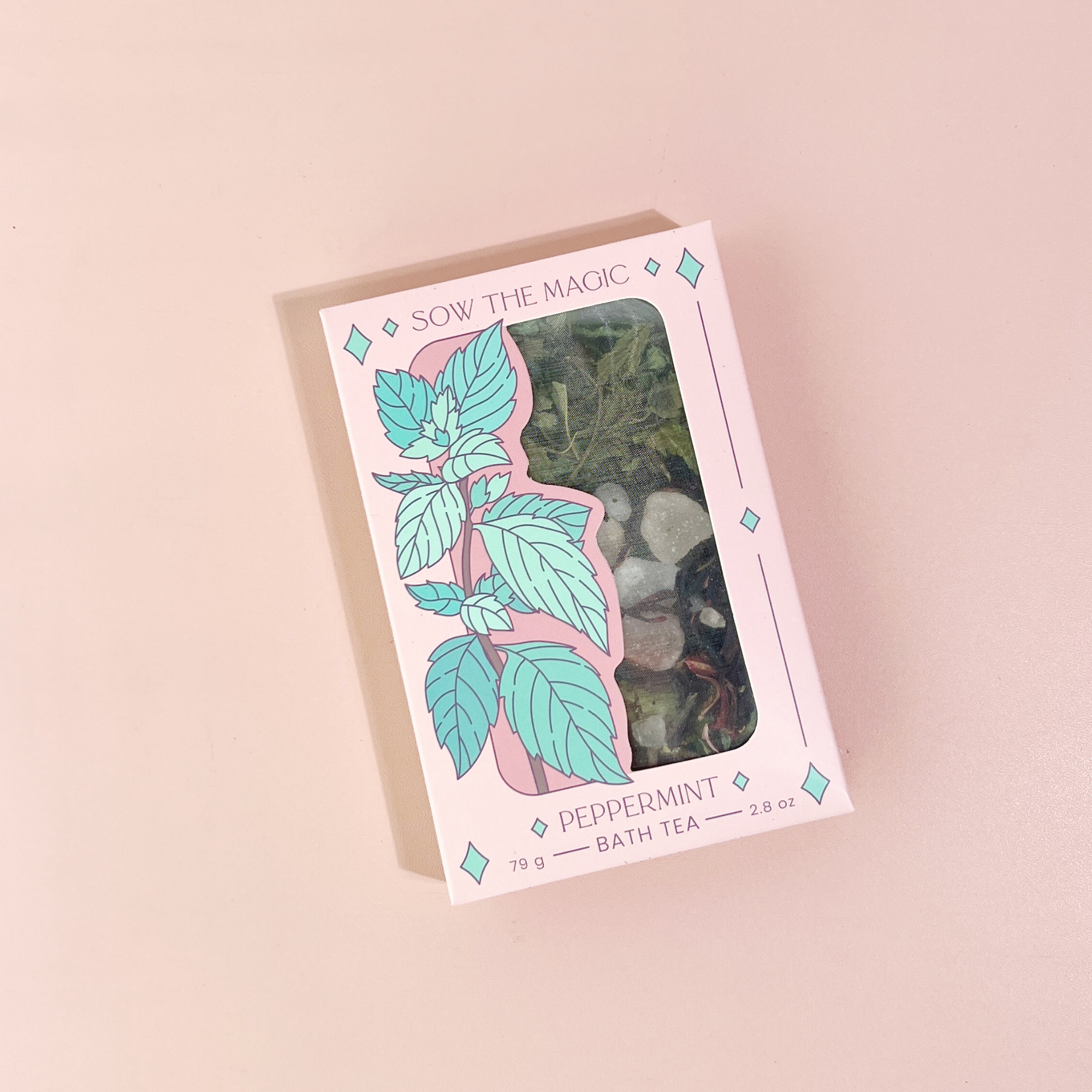 Peppermint Tarot Botanical Bath Tea Box front illustration showing tea bag inside on pale pink background.